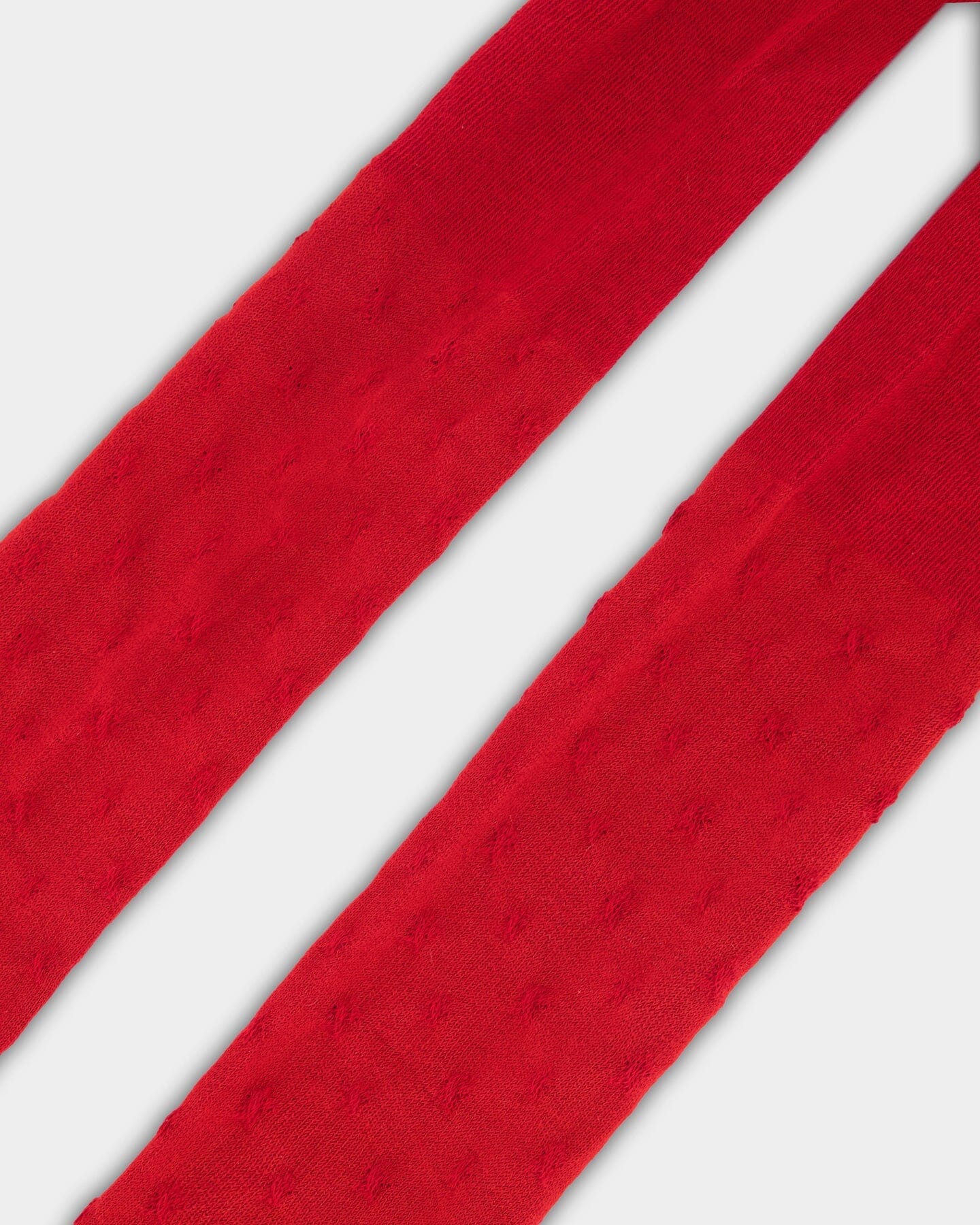 Collant en maille rouge avec motif étoile ton sur ton