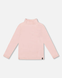 Haut rose côtelé ultra-doux à col montant
