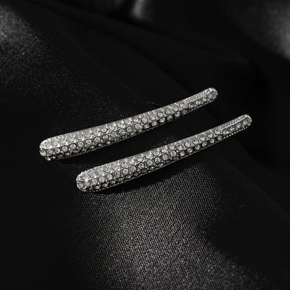 Style HILO: Boucles d'oreilles clous incurvées pavées de zircones en argent