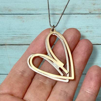Collier double cœur – Long, métaux mélangés, pendentif or rose et argent