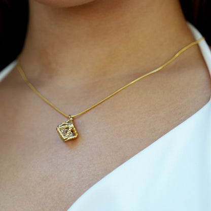 Style KARJAT: Gold Chain Necklace with Geometric Caged Zirconia Pendant