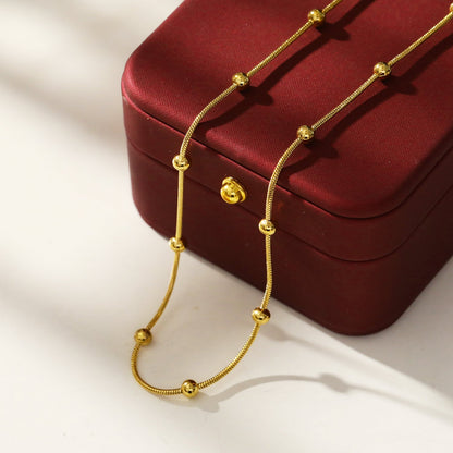 MAKARIA : Collier chaîne texturé serpent avec perles en forme de boule