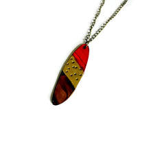 Pendentif ovale rayé or rouge marron