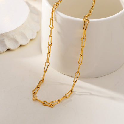 TIASA : Collier chaîne en or à trombones asymétriques