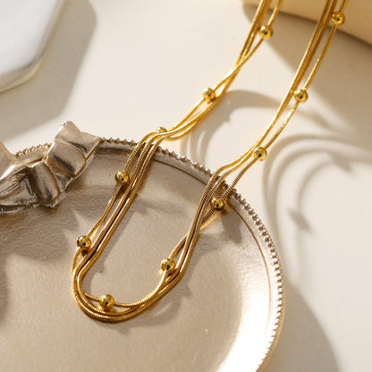 KAKIA : Collier superposé Triple Chaîne Peau de Serpent avec perles