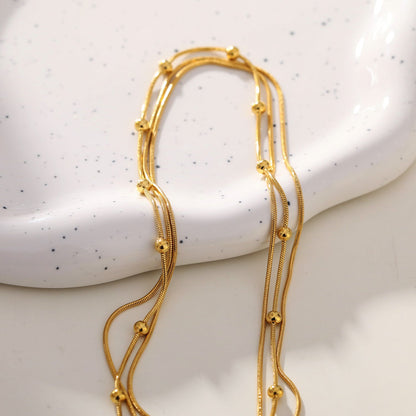 KAKIA : Collier superposé Triple Chaîne Peau de Serpent avec perles