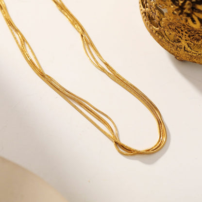 AVEZZANO Gold : Collier multirangs texturé peau de serpent - Élégance exquise
