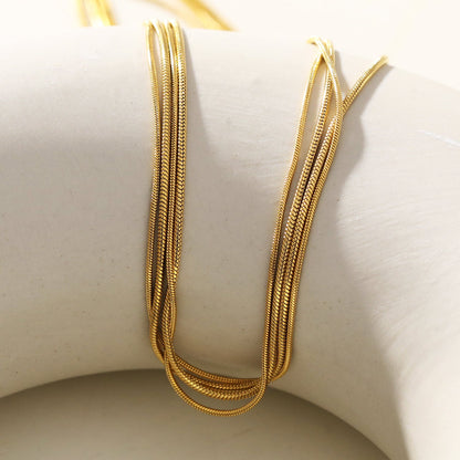 AVEZZANO Gold : Collier multirangs texturé peau de serpent - Élégance exquise