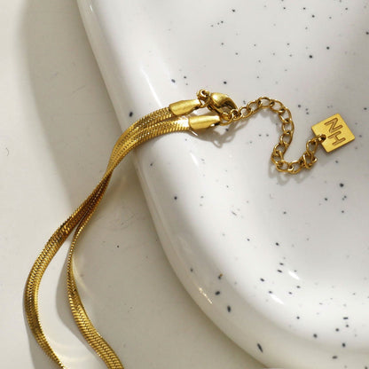 Collier chaîne torsadée type lasso GILMA avec texture peau de serpent
