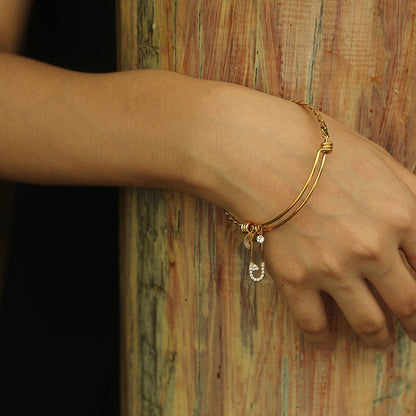 CHRISTINA : Bracelet en Or Orné de Breloques