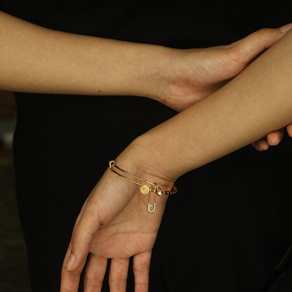 CHRISTINA : Bracelet en Or Orné de Breloques