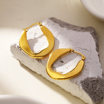 CALIXIA « Sophistication sculptée : Découvrez l'attrait des boucles d'oreilles créoles géométriques irrégulières ! ».
