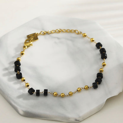 ROSARIO : Bracelet chaîne avec perles en onyx noir et or