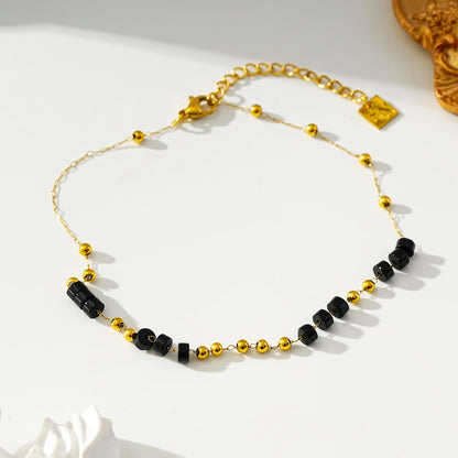 ROSARIO LG: Bracelet de cheville à chaîne de perles en onyx noir et or