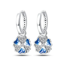 Boucles d'oreilles créoles en argent sterling avec breloque fleur bleue élégante
