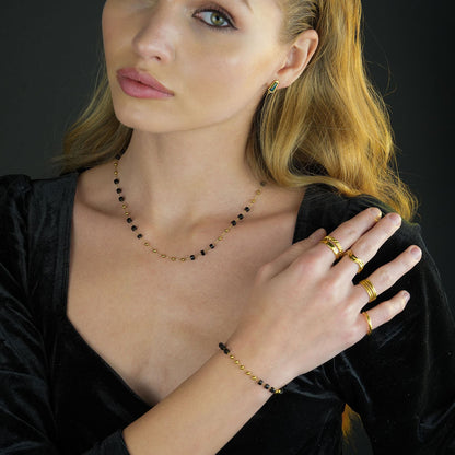 SANTA CRUZ Noir : Collier ras du cou en perles d'onyx noir et or