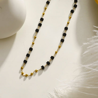 SANTA CRUZ Noir : Collier ras du cou en perles d'onyx noir et or