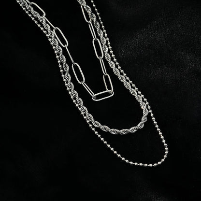 SELENE : Collier triple couche en chaîne mélangée en or blanc rhodié