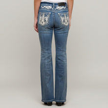 Jean bootcut à strass pour femme Skull Rider. Jean western taille haute brodé
