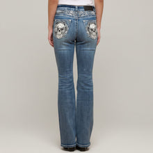 Jean bootcut taille haute pour femme avec broderies tête de mort et rose ornées de strass, Skull Rider.