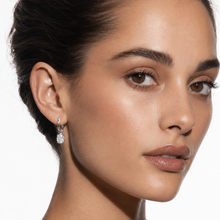 SEDONA Silver (White Gold): Mini Hoop Earrings Anchoring an Encased Zirconia (CZ) Charm