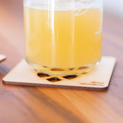 Wooden coasters with openwork designs