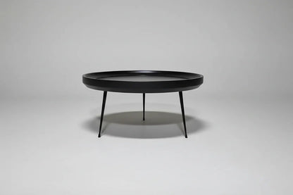 Round coffee table in black-finished mango wood
