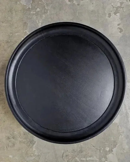 Round coffee table in black-finished mango wood