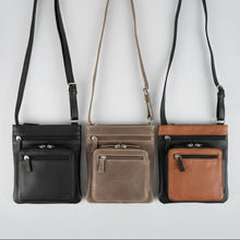 Sac bandoulière JBG Slim en cuir véritable. Sac de voyage avec protection RFID et poches à fermetures éclair multiples.