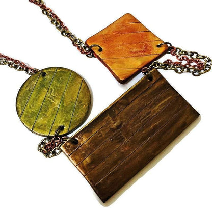 Collier plastron géométrique avec double chaîne en bronze et cuivre