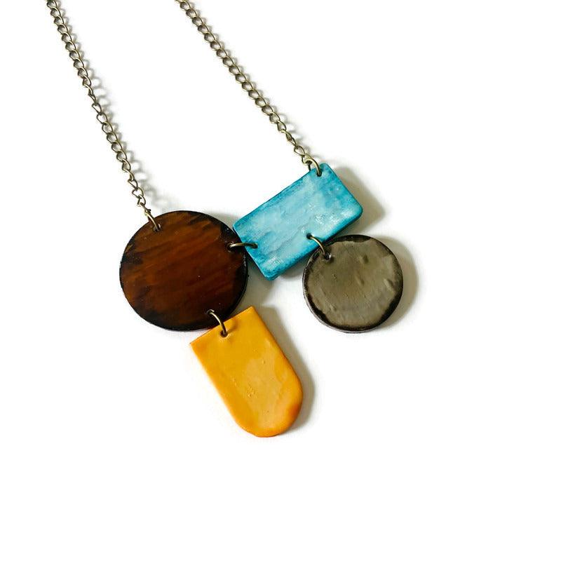 Parure de bijoux géométriques uniques bleu layette, pêche, marron et gris